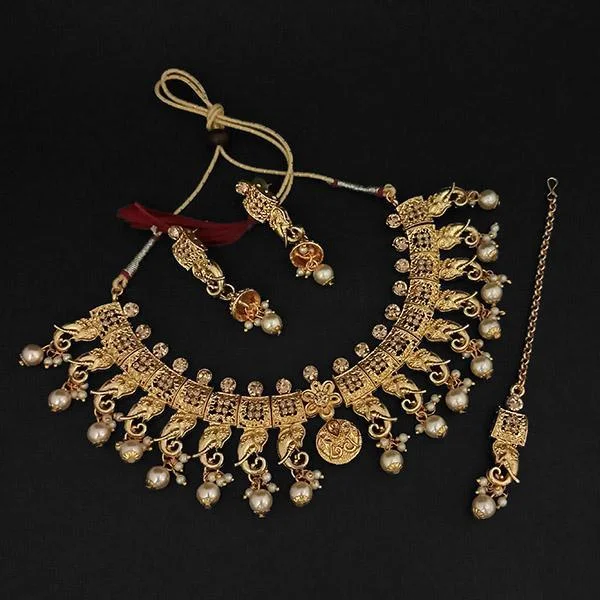 Oval charm necklaces-Kriaa Gold Plated Brown Austrian Stone Necklace Set With Maang Tikka -1107990A